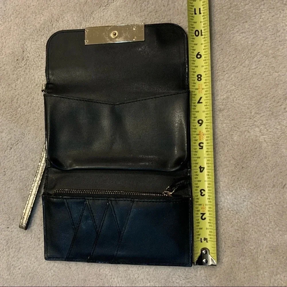 VICTORIA’S Secret shimmer phone wallet, golden